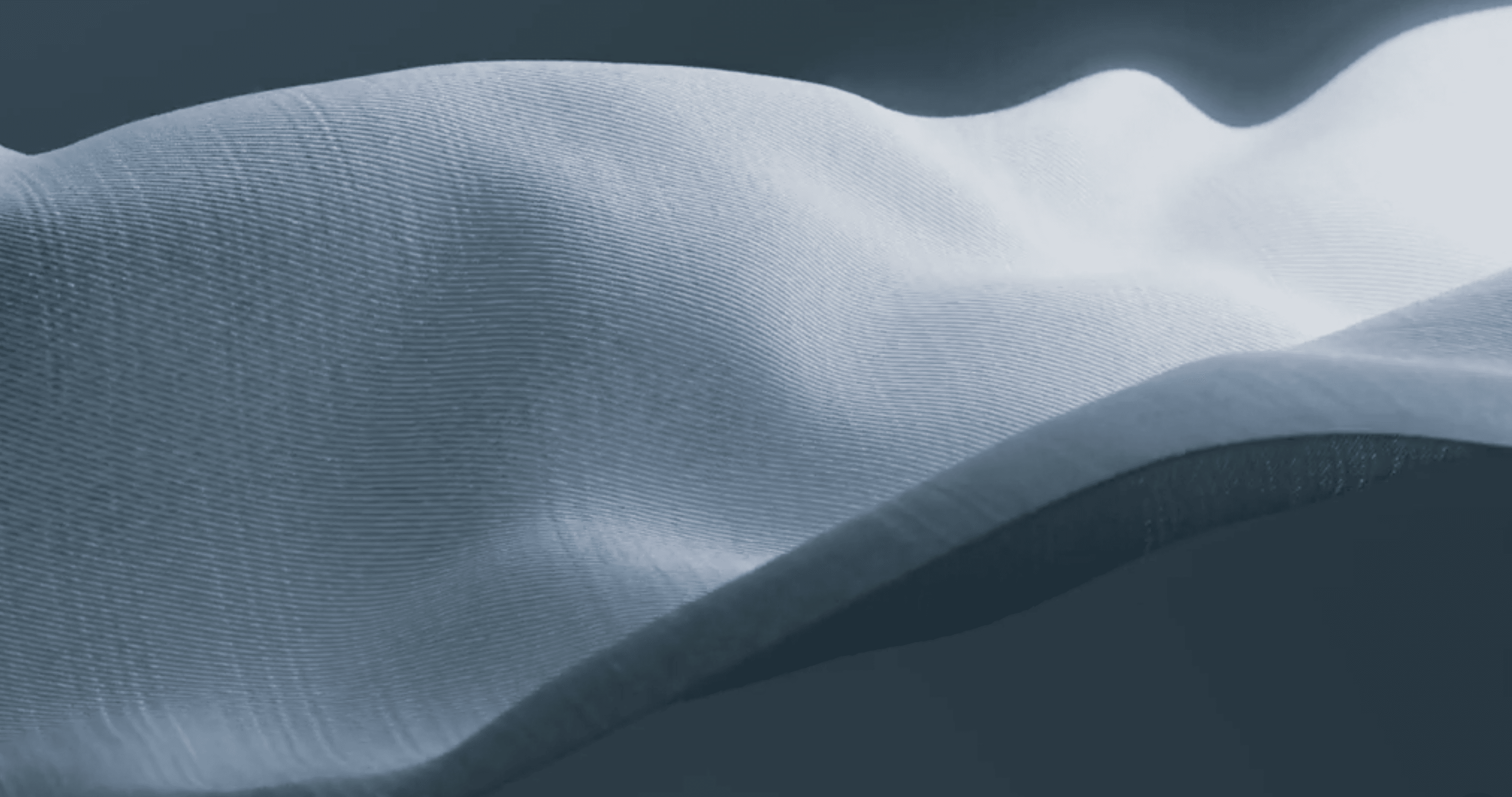 Close-up of softly folded pale technical fabric